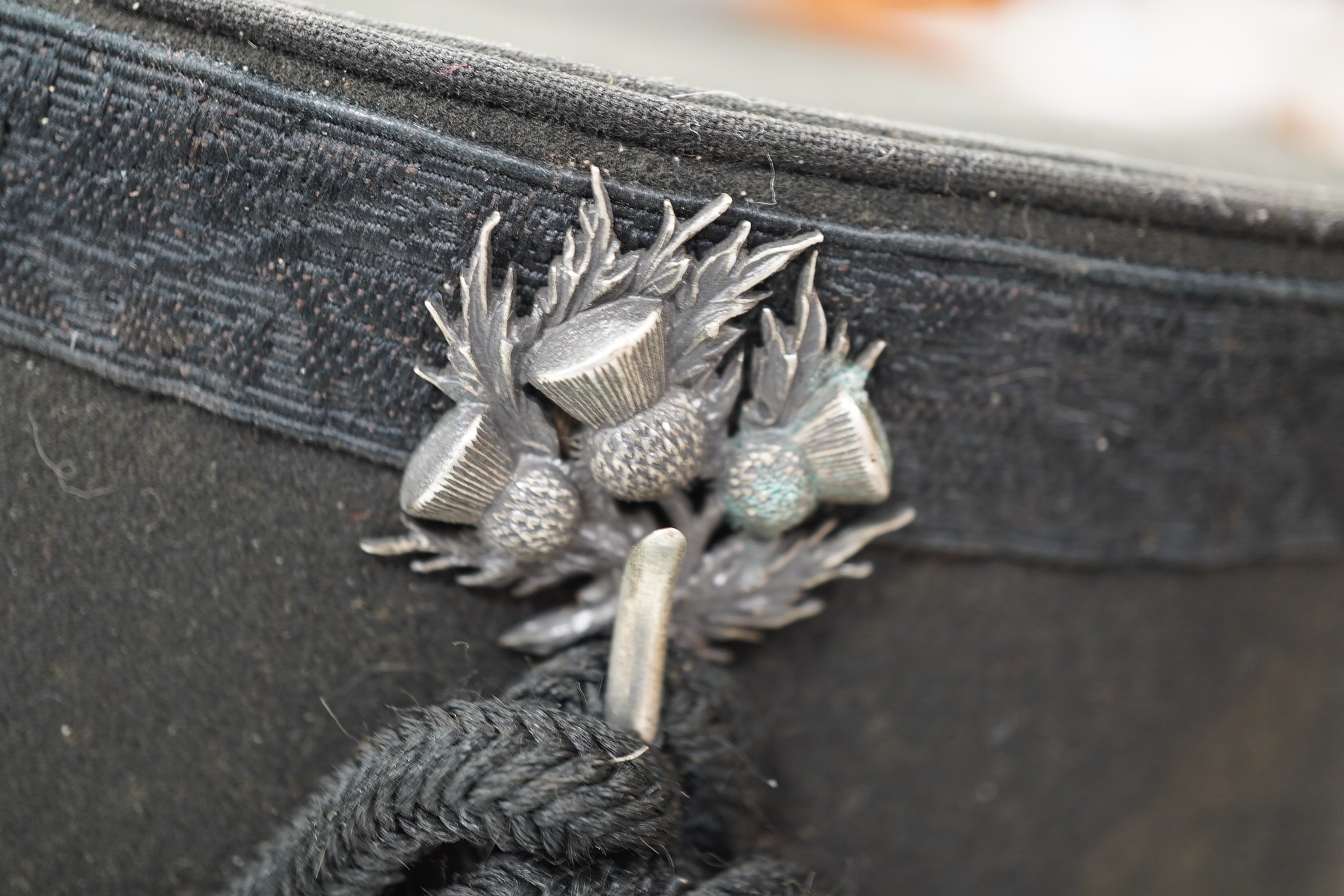 A Victorian tin cased Scottish Rifles officer's shako by Cater & Co. Pall Mall, London, with cap badge for the Cameronians, Applied plaque to lid engraved R. Robertson Esq. 2nd Scottish Rifles. Condition - fair to good,